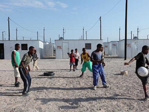 Children playing football in Blikkiesdorp (c) Michael Blake